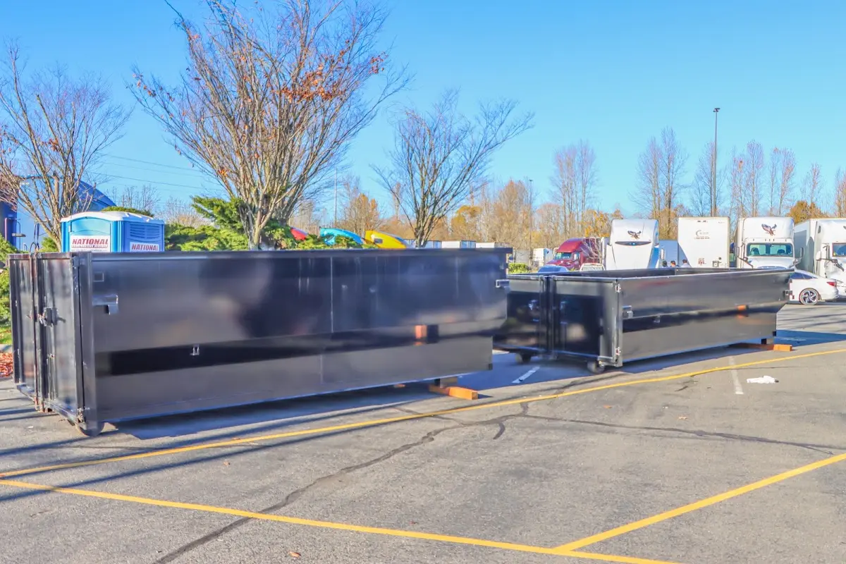 Professional dumpster rental service with roll-off container on residential driveway in Oklahoma City